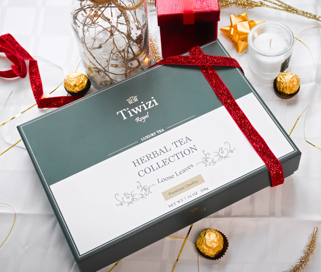 A closed luxury Tiwizi premium herbal tea gift box wrapped with a red ribbon